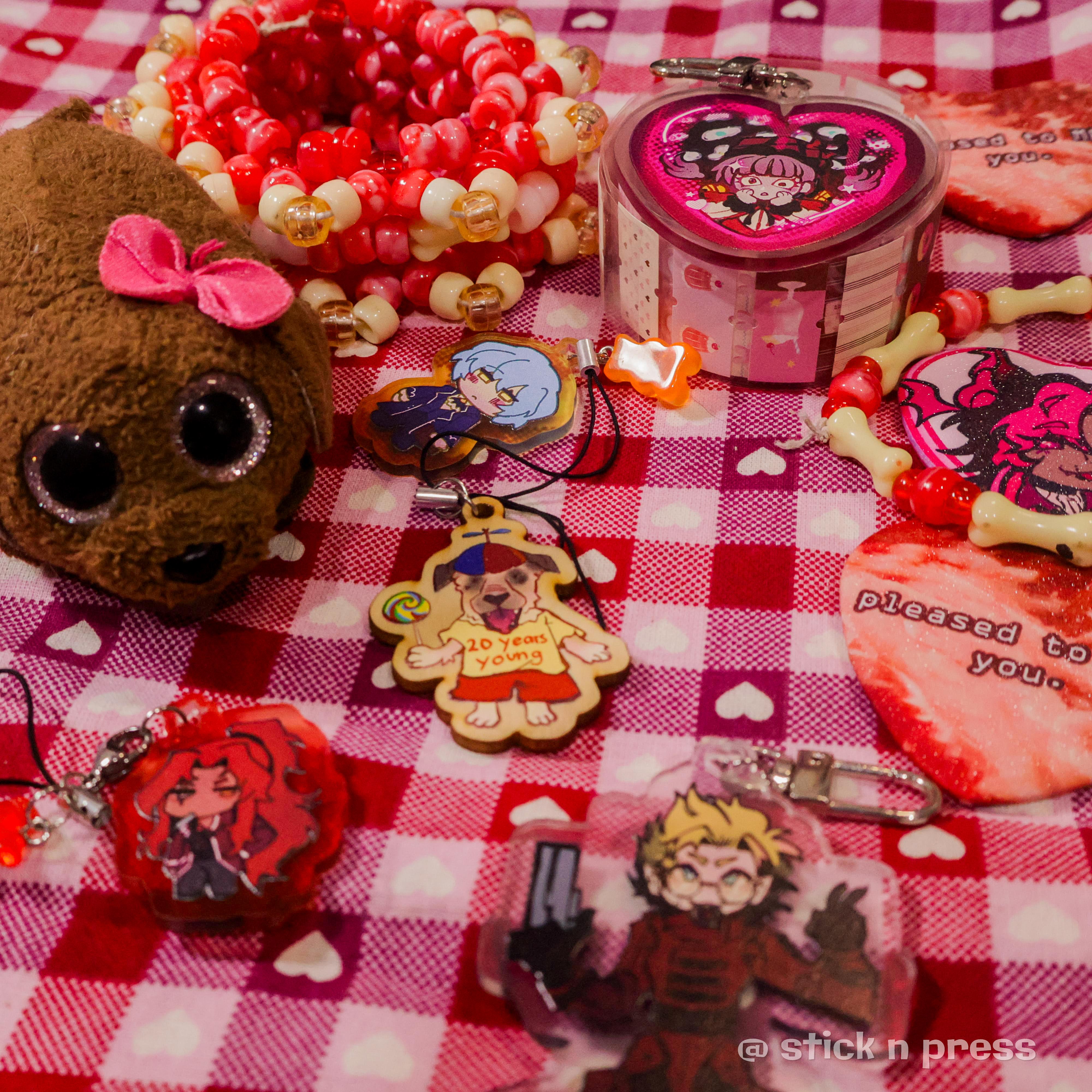 Keychain merchandise arranged on a cloth backdrop